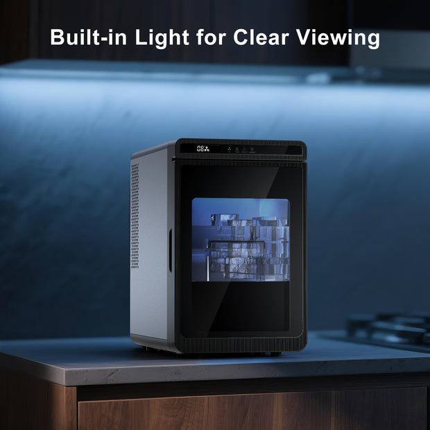 Small ice maker with a built-in light on a dark background